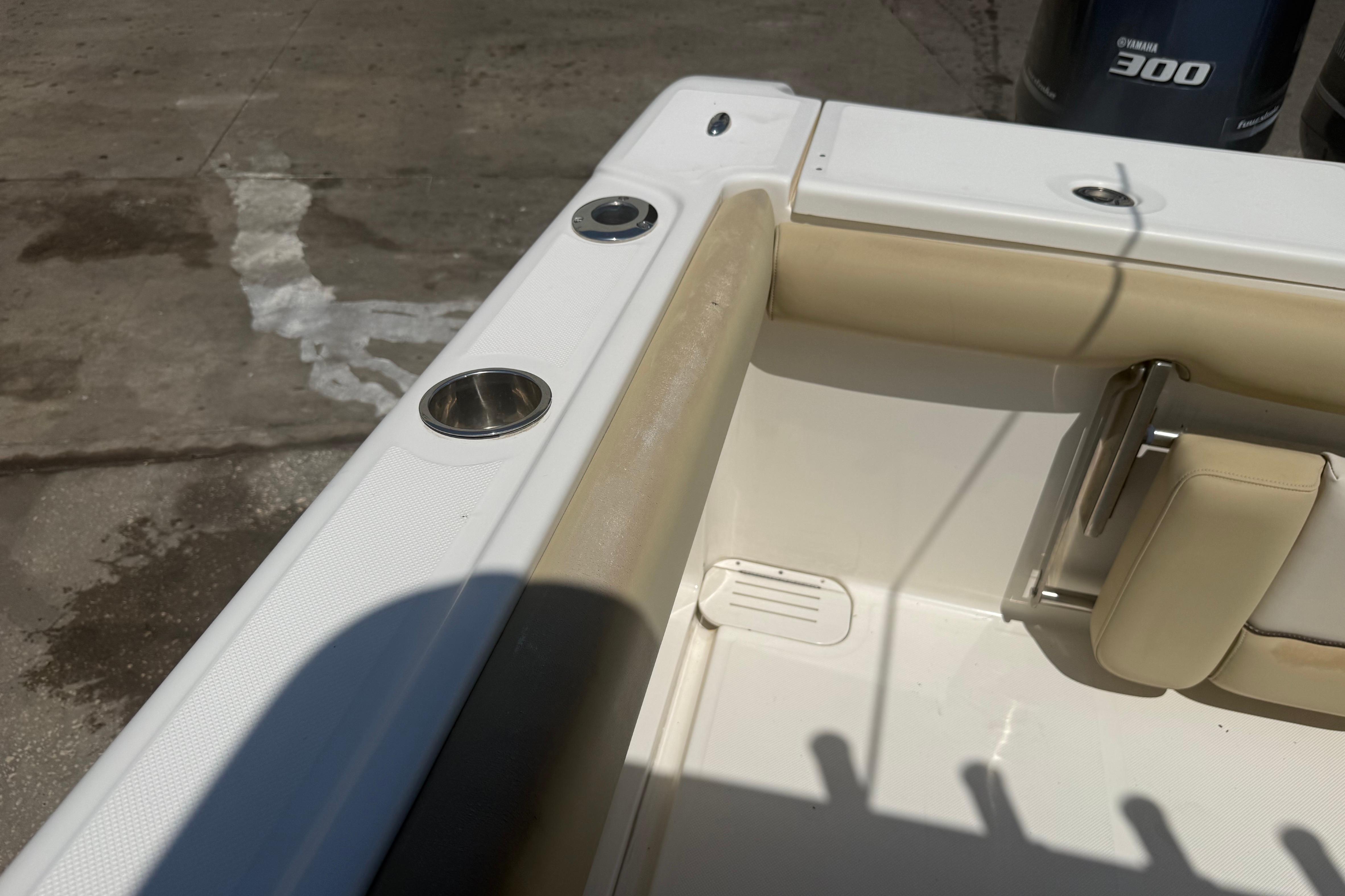 2019 Key West Billistic 281 Center Console boat interior with beige seating and cup holders.