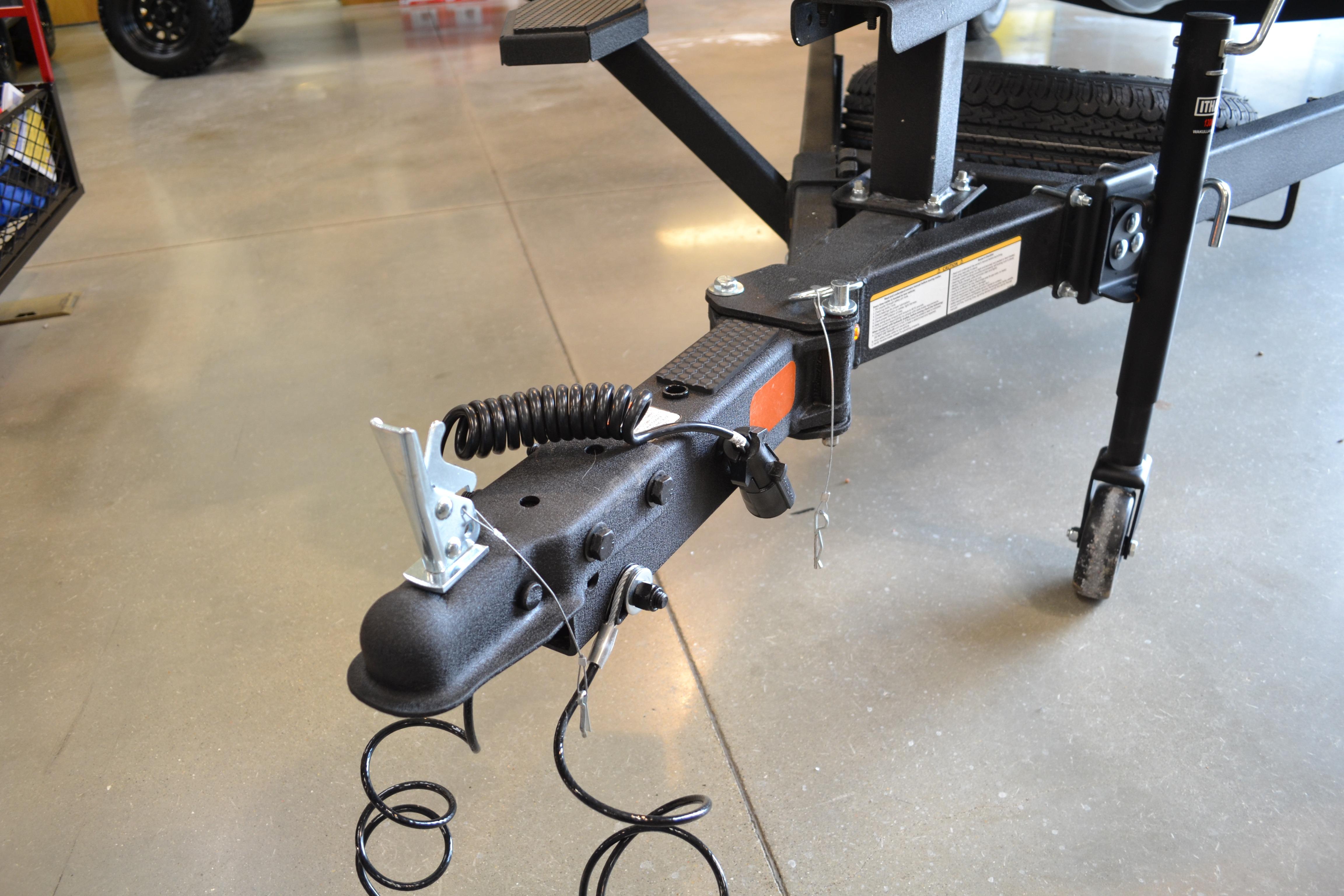 Trailer hitch of 2026 Ranger RT178C boat, featuring safety chains and jack wheel.