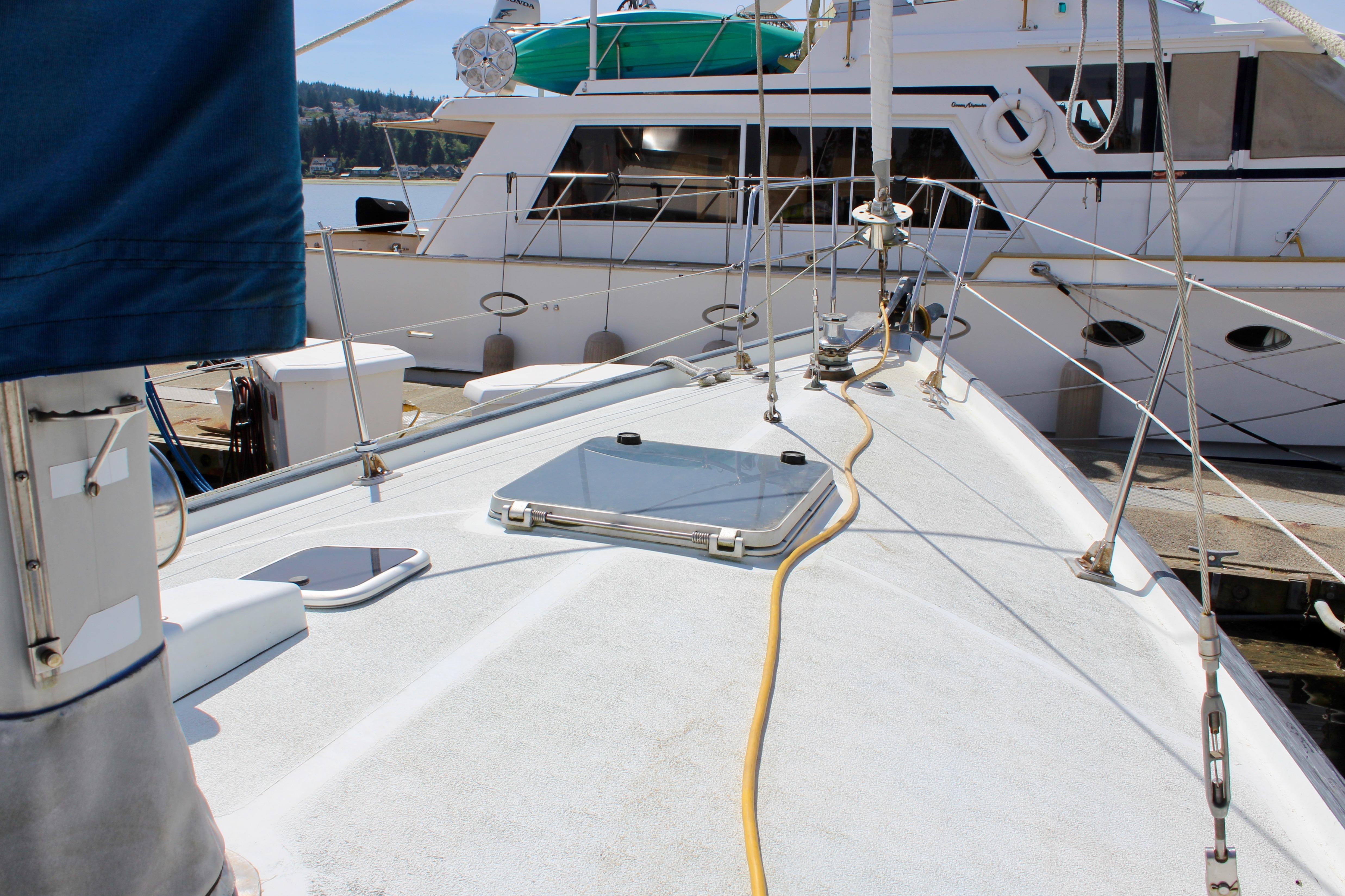 Deck view of a 1993 Freya 39 sailboat docked at a marina.