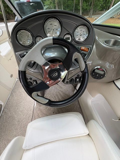 The image shows the cockpit of a 2007 Rinker 226 Captiva Bowrider with a modern dashboard.