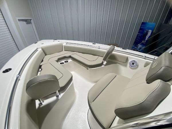 2024 Key West 219 FS boat interior with beige seating and modern design.