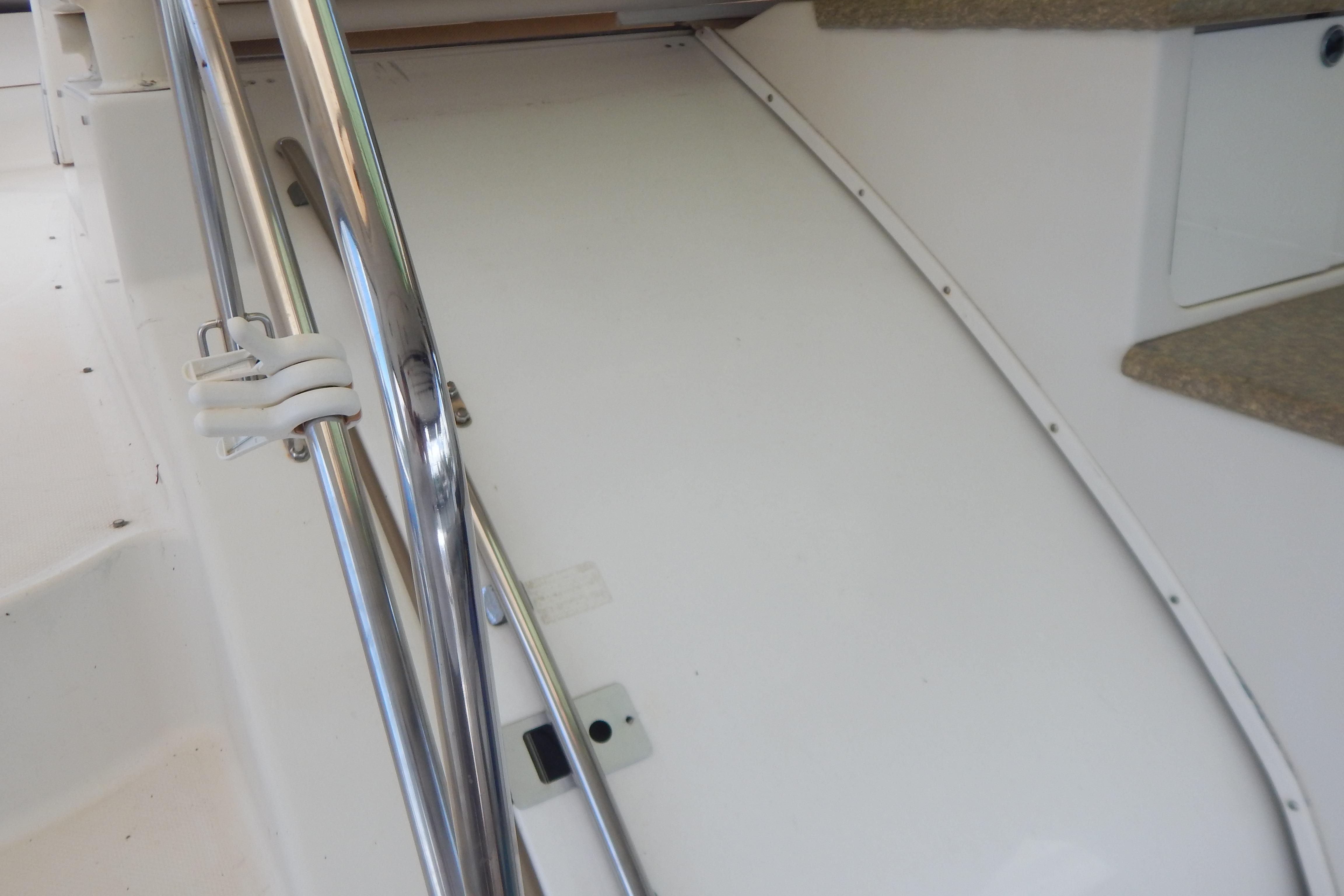 Interior view of a 1998 Magnum 4100 SCR boat with metal railing.