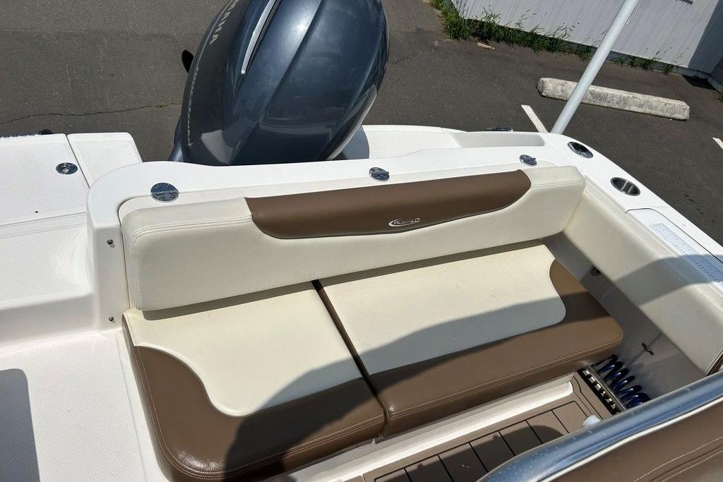 2017 Robalo R200ES boat with brown and white seating, featuring a sleek outboard motor.