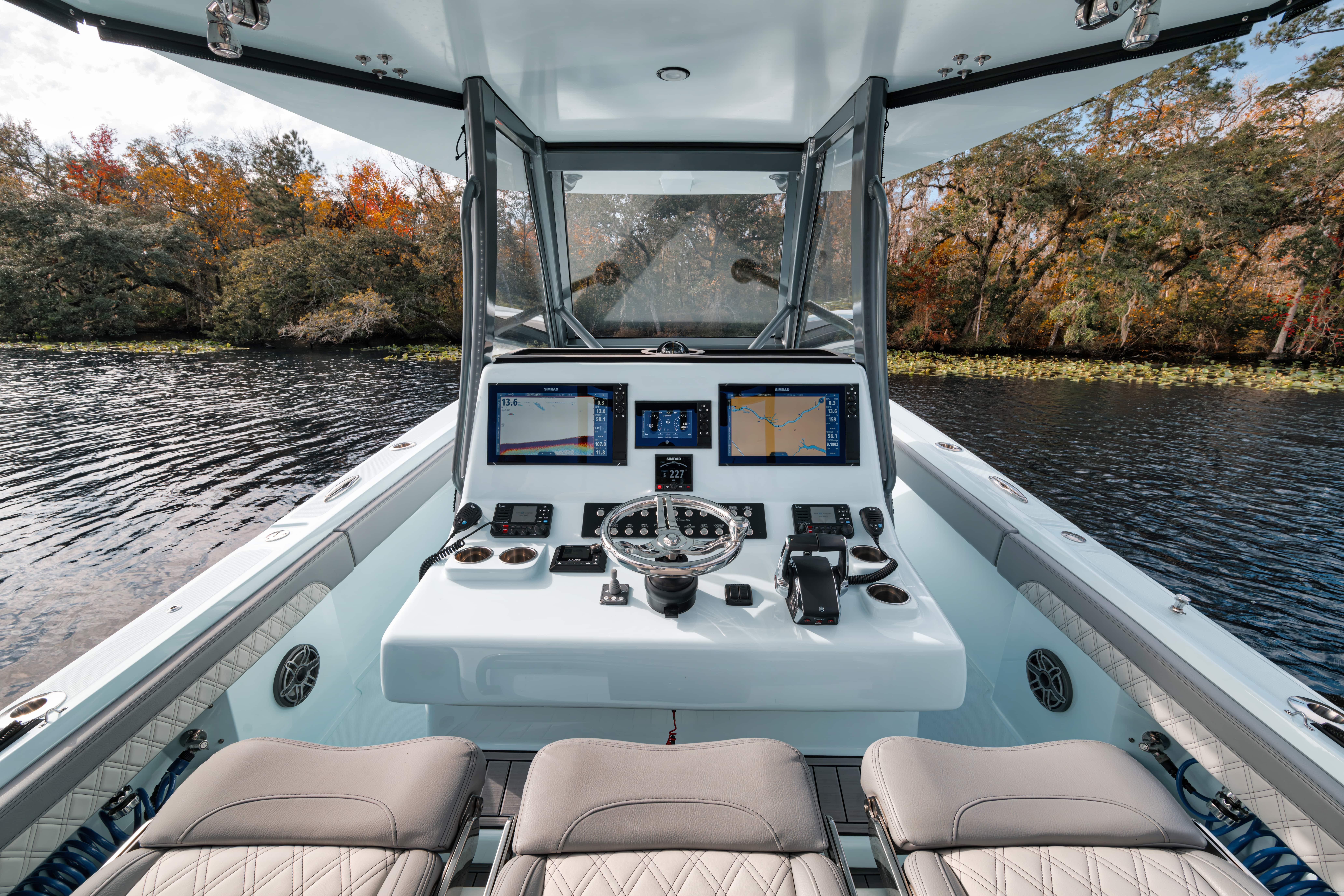 2026 Front Runner 36' Center Console boat interior with advanced navigation system on a scenic lake.