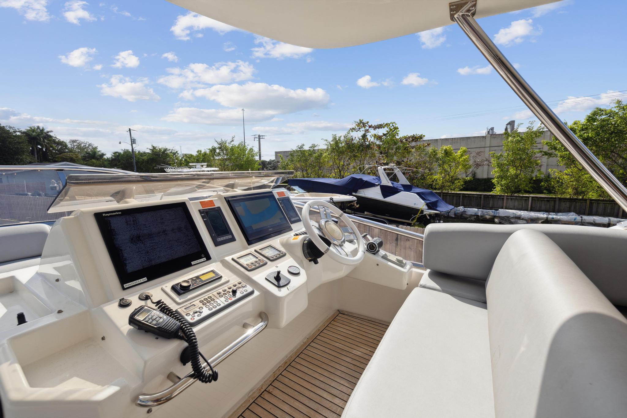 Cockpit view of a 2013 Azimut 70 yacht with modern navigation equipment.