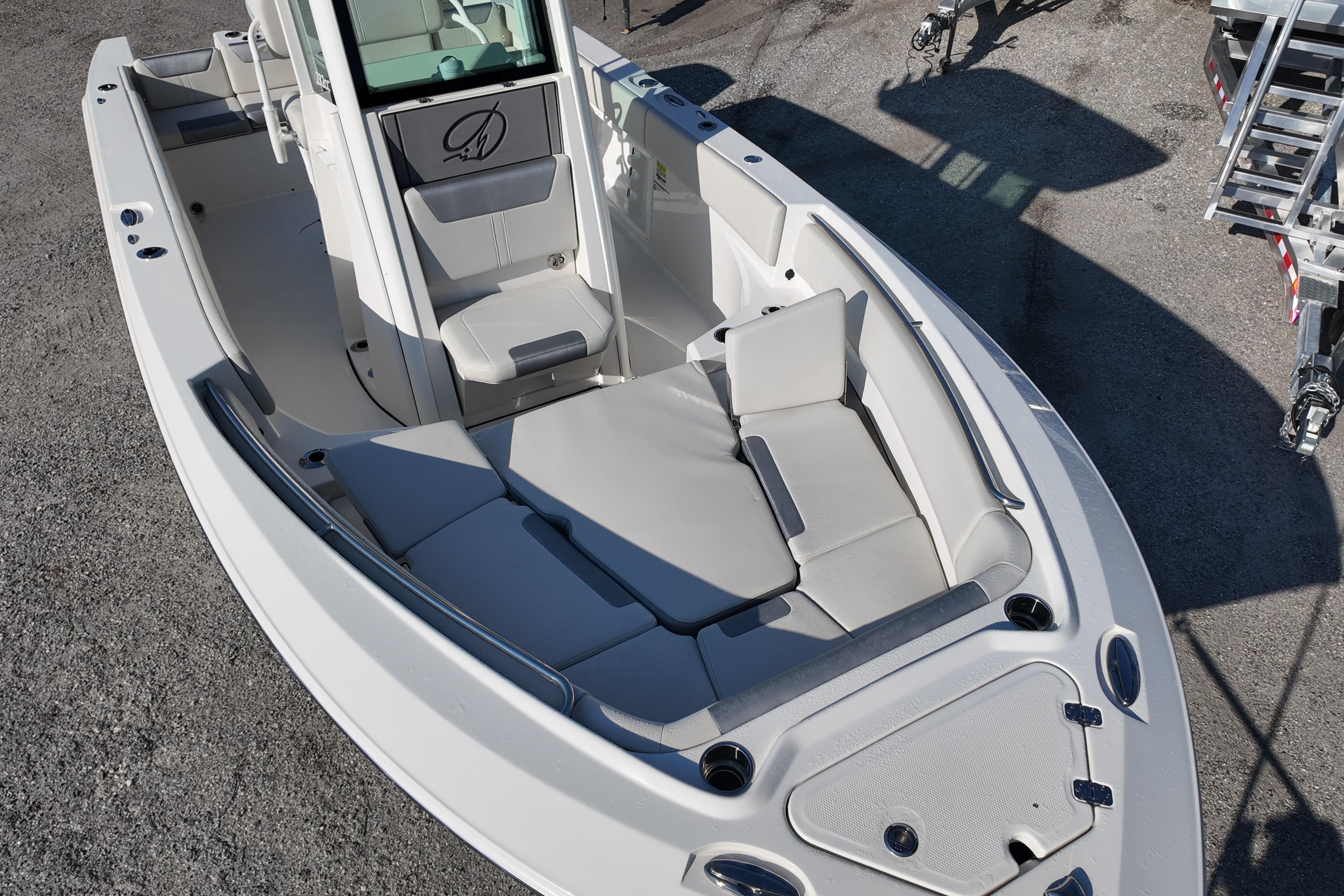 2026 Sailfish 232 CC boat interior with cushioned seating and storage compartments.