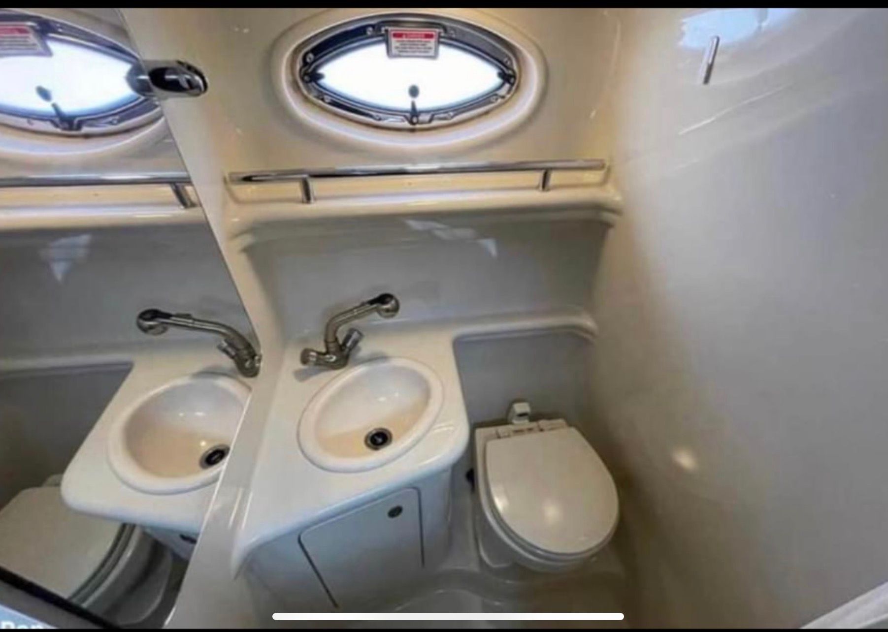 Interior of 2006 Sea Ray 270 Amberjack with sink and toilet.