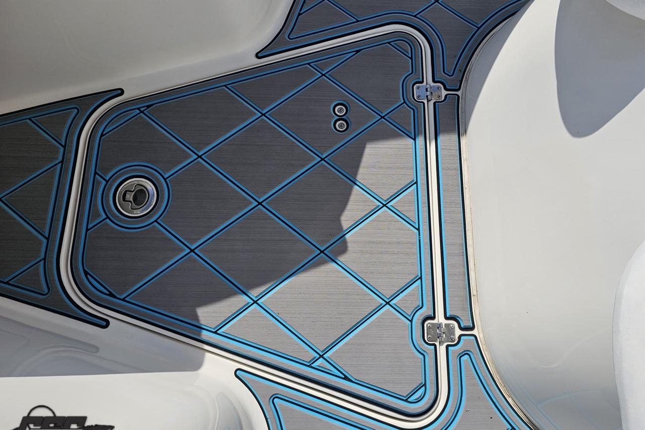 Deck detail of 2013 Sea Fox 286 Commander boat with blue and gray pattern.
