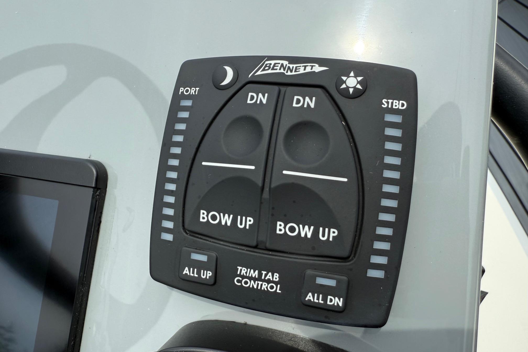 Bennett trim tab control panel on 2026 Maverick 17 HPX-S boat dashboard.