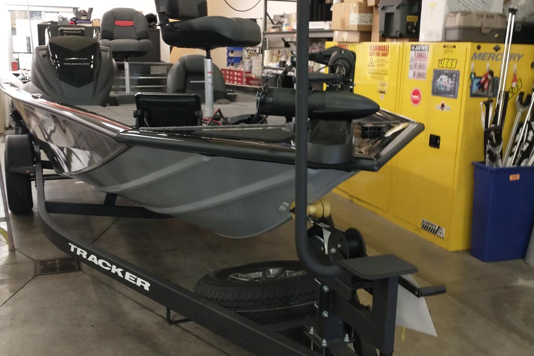 2026 Tracker Pro Team 195 boat on trailer in a garage setting.