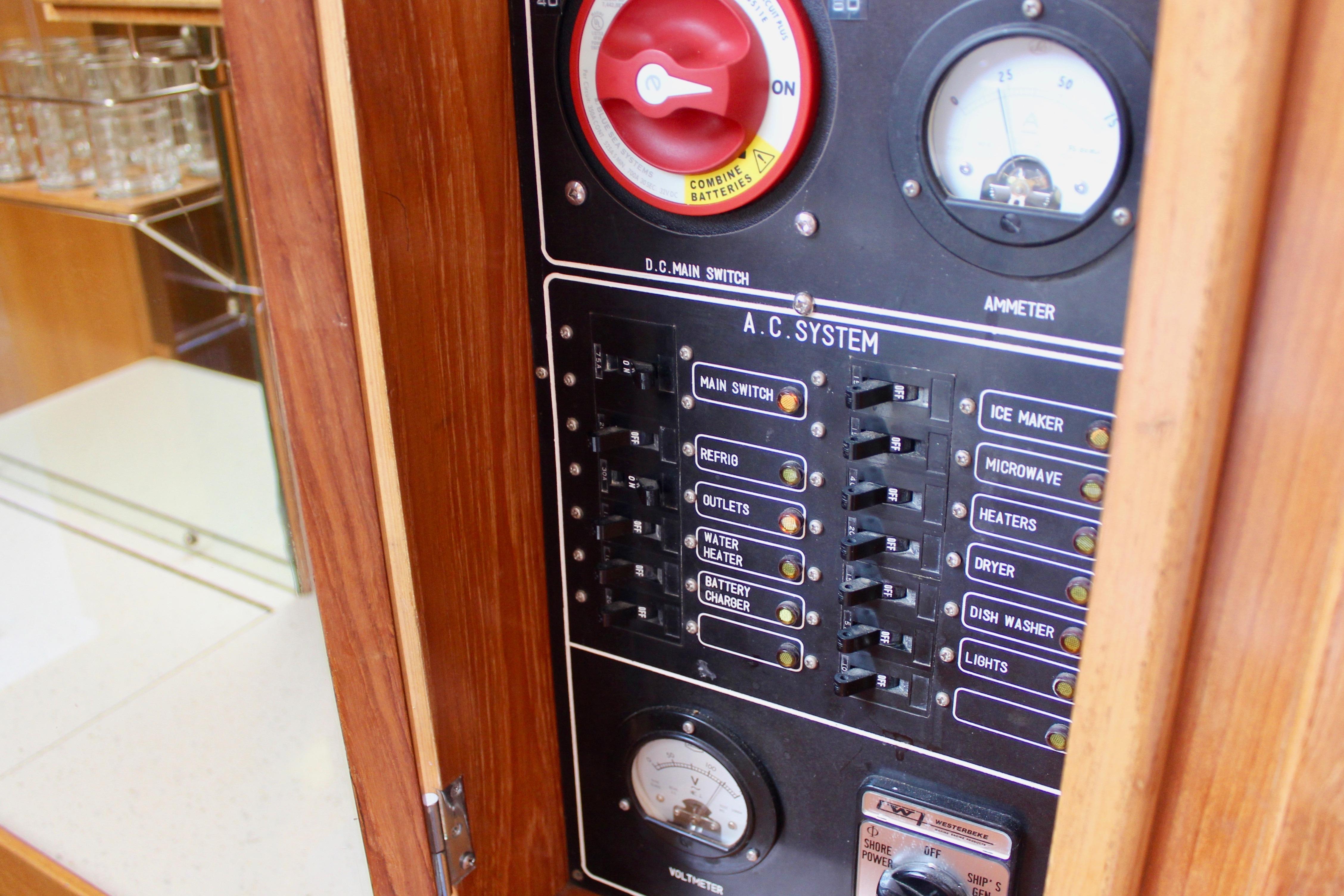 Electrical panel of 1986 Kha Shing Spindrift 46 yacht with switches and ammeter.