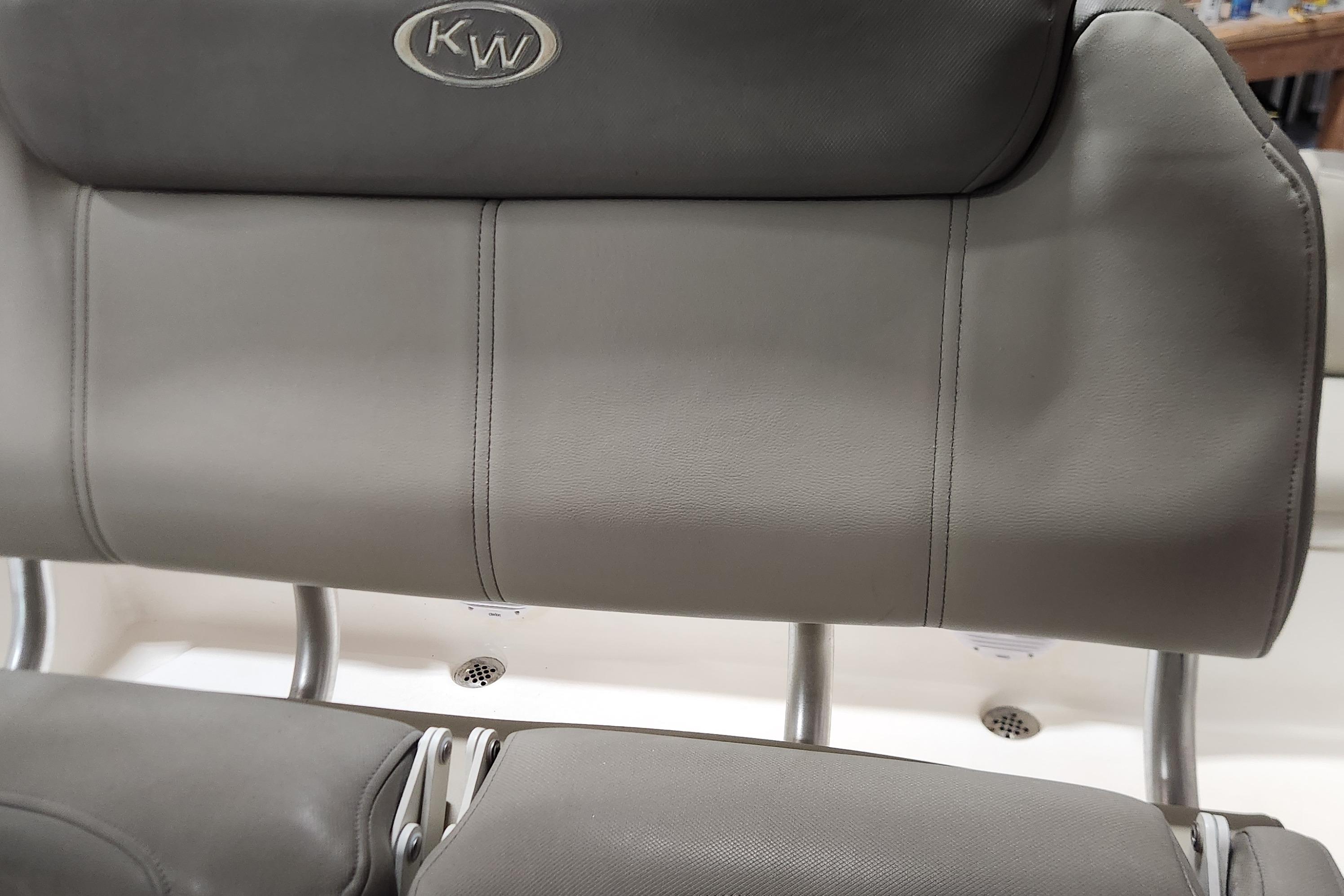 Gray leather seating on 2023 Key West 219 FS boat, featuring KW logo.