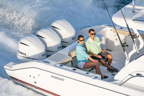 Manufacturer Provided Image: 2019 Pursuit OS 355 Offshore boat with Yamaha engines, couple enjoying the ride.