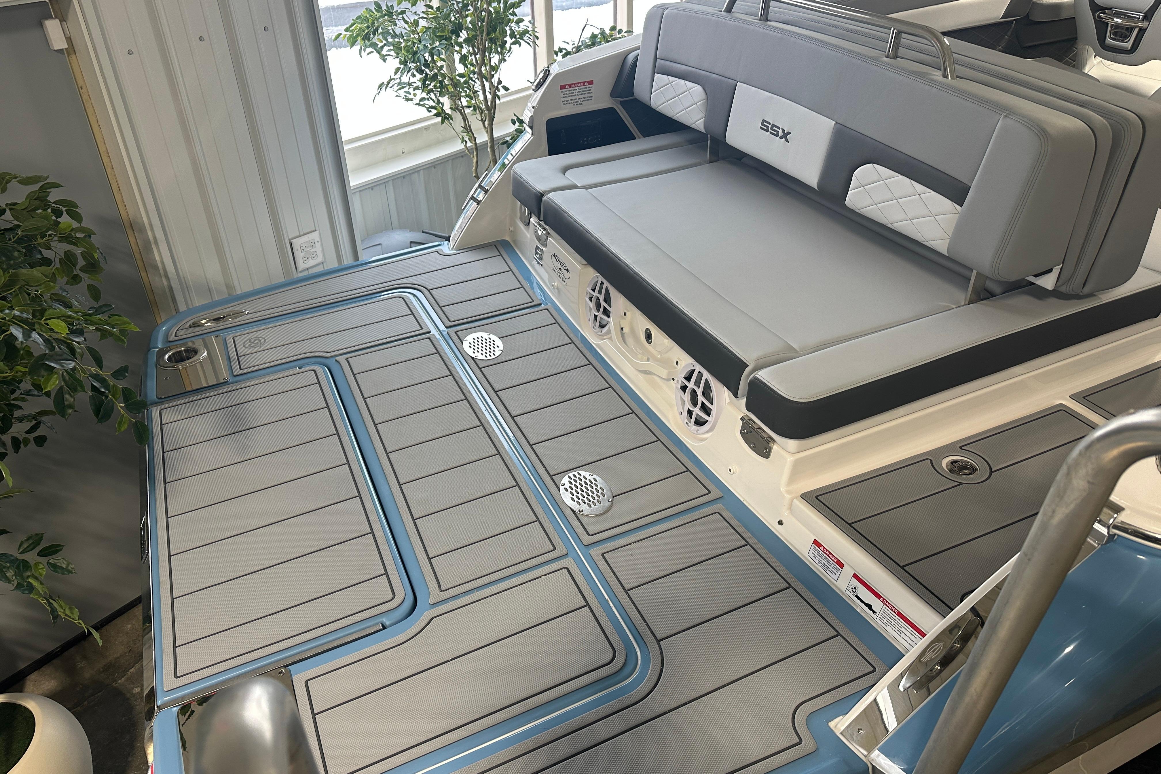 Chaparral SSX 6 2026 boat rear with gray upholstery.
