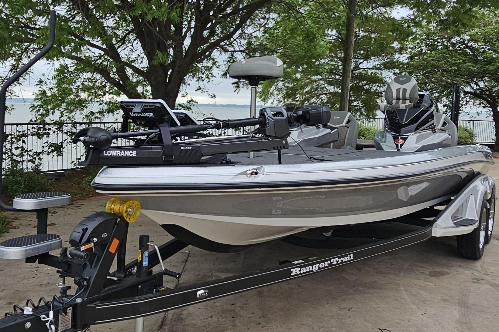 2026 Ranger Z521R Cup-Equipped boat on trailer by the lake.