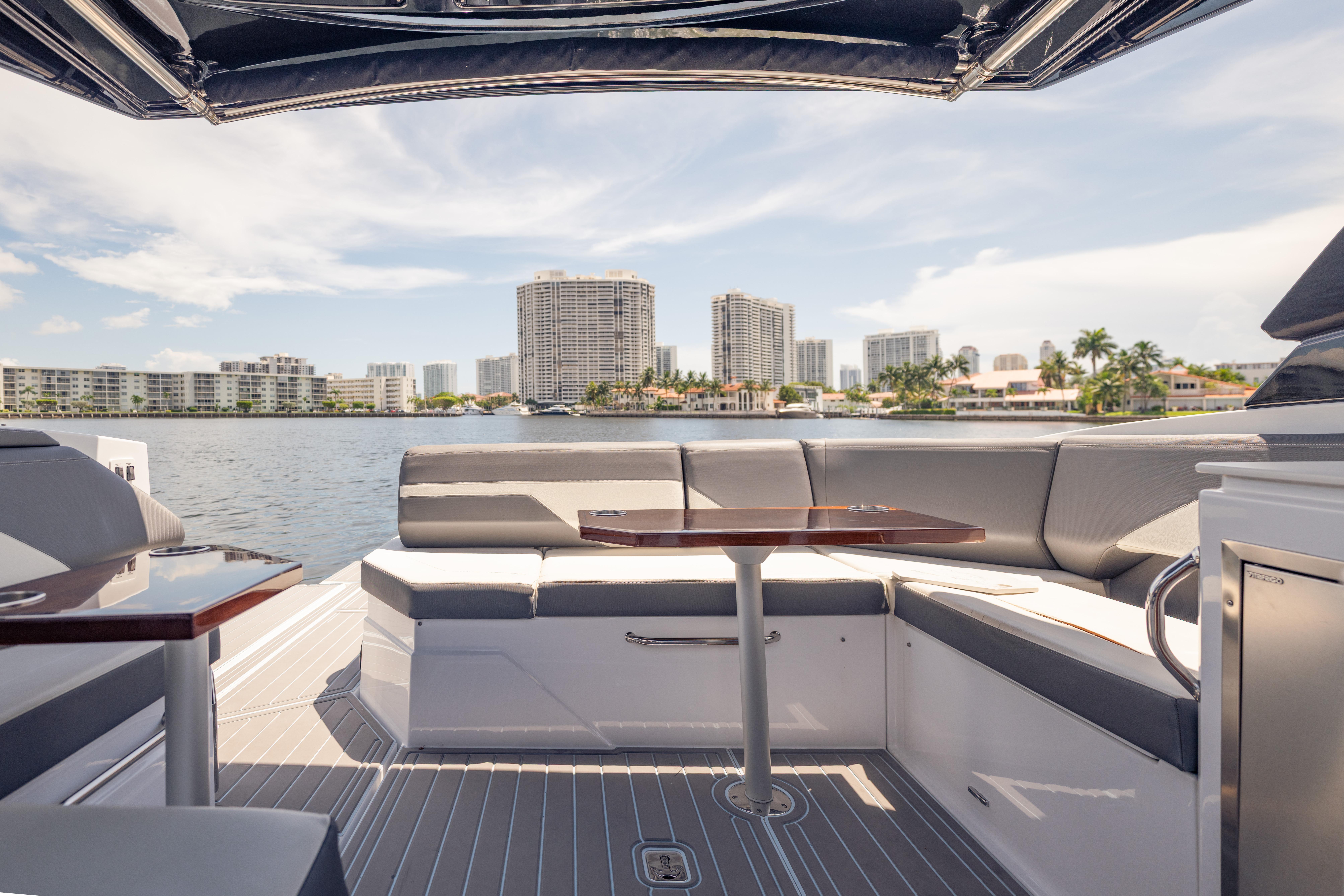 2021 Cruisers Yachts 38 GLS interior with waterfront cityscape view.