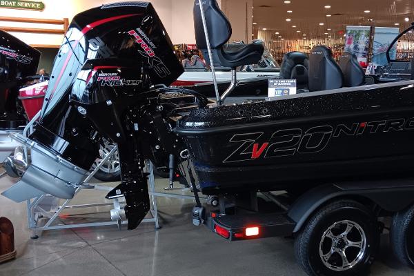2025 Nitro ZV20 boat with powerful outboard motor displayed indoors.
