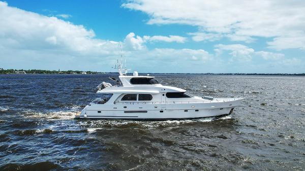 Grand Harbour 76 yacht cruising on open water, 2001 model.