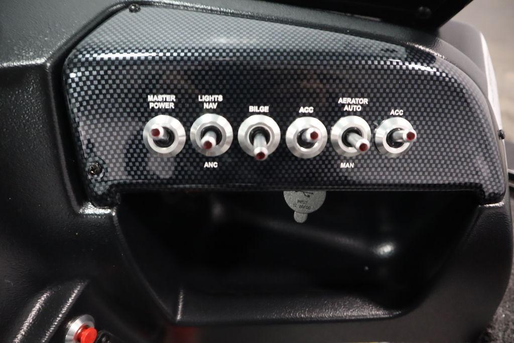 Control panel of 2026 Lowe Fishing Machine 175 with multiple switches.