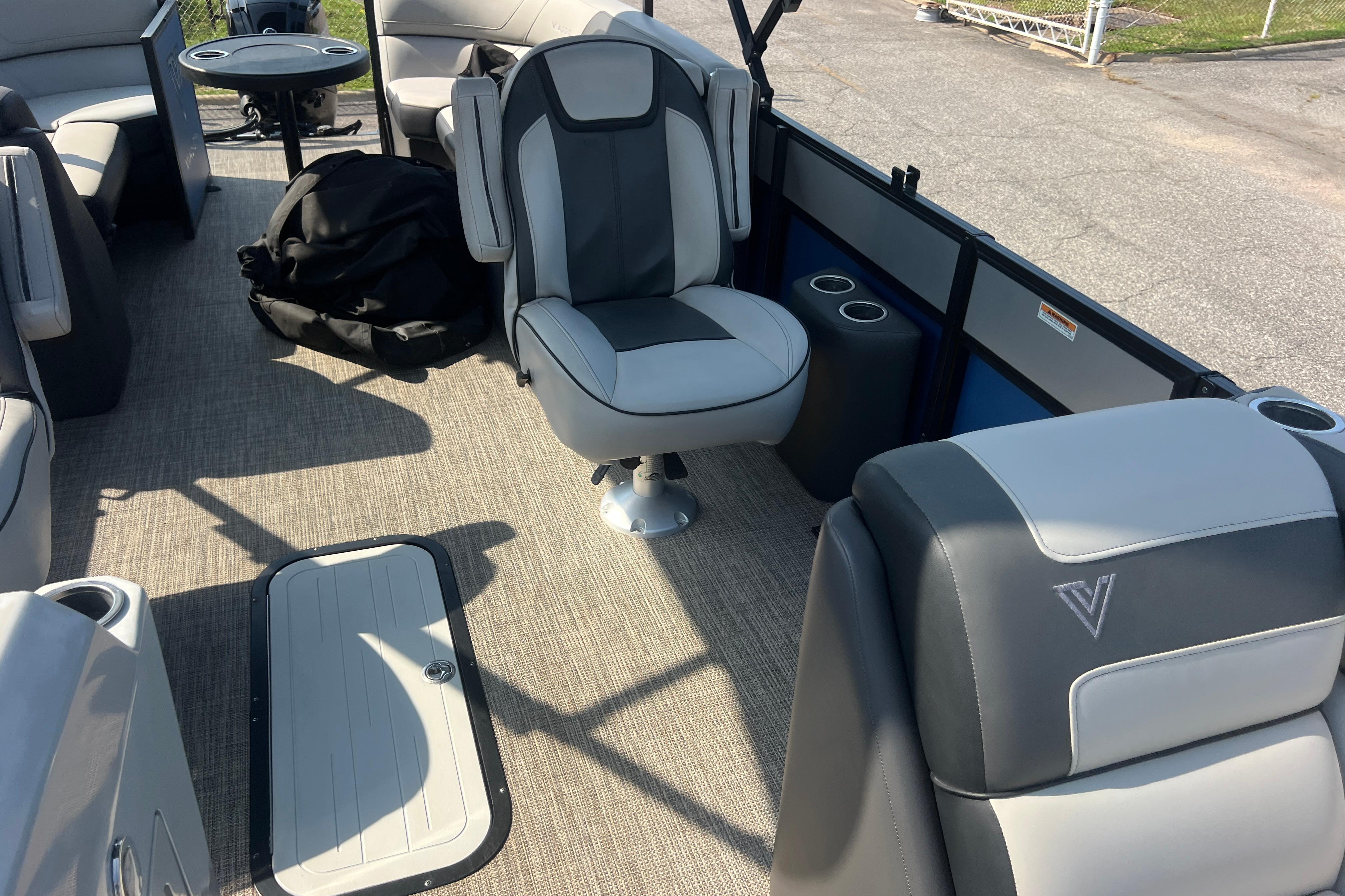Interior of 2022 Viaggio Lago V-U 22 pontoon boat with seating and storage.