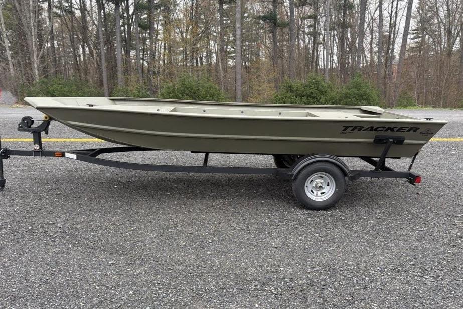 2026 Tracker Grizzly 1754 Utility boat on trailer, parked outdoors.