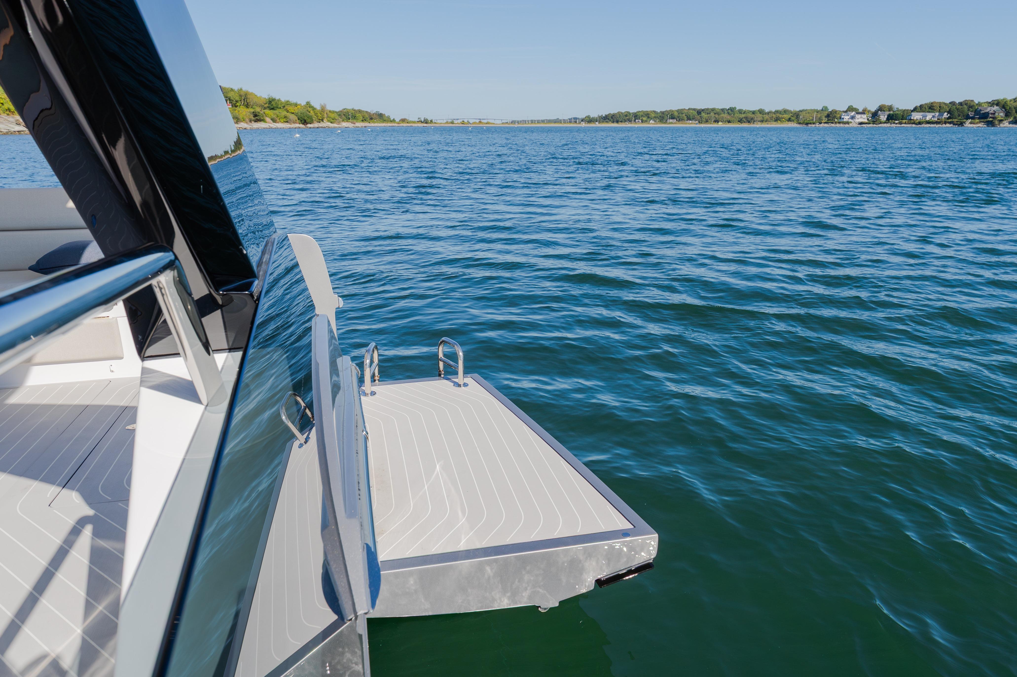 2023 Azimut Verve 47 yacht with swim platform on serene blue water.