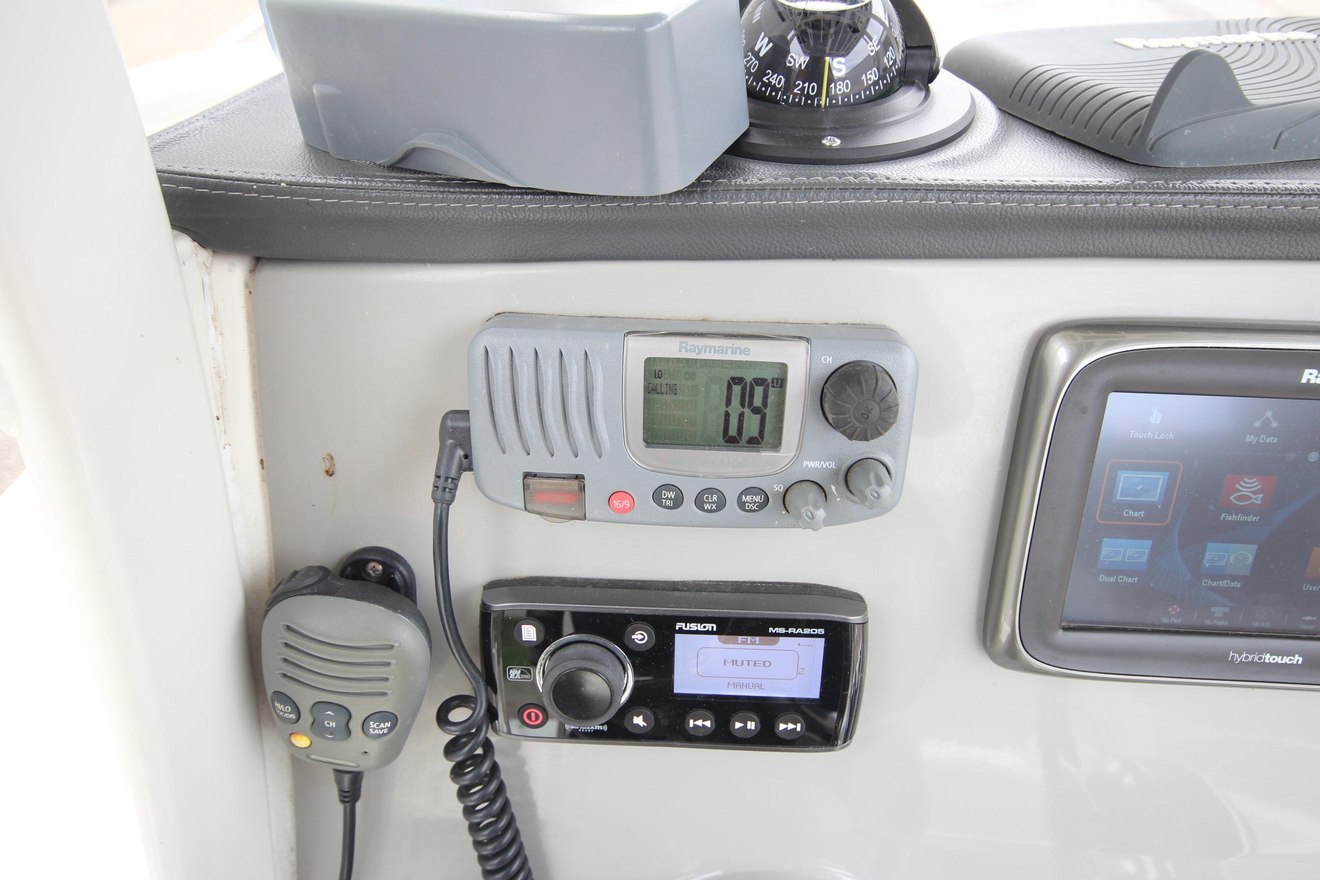 Control panel of a 2014 Boston Whaler 210 Dauntless with navigation and communication equipment.