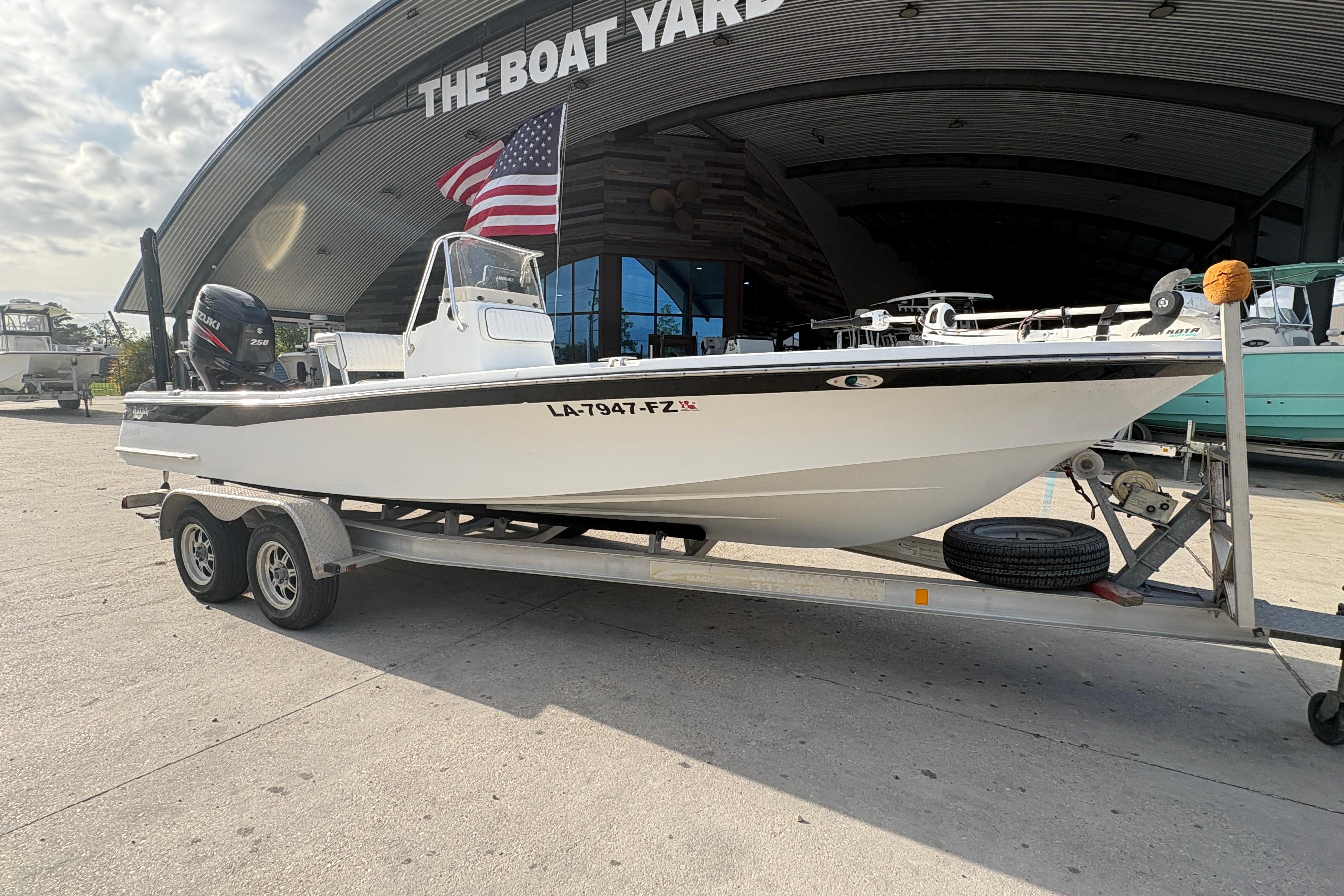 2012 BlackJack 224 boat on trailer at The Boat Yard, featuring Suzuki engine.