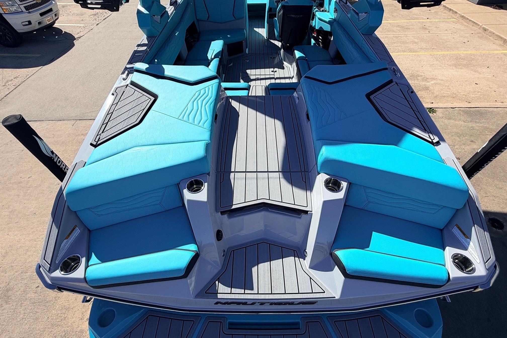 2026 Nautique Super Air Nautique G23 boat with vibrant blue seating and sleek design.