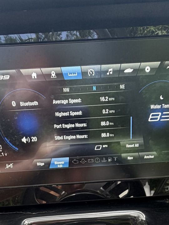 The image shows the dashboard of a Yamaha 212SD boat with digital displays.