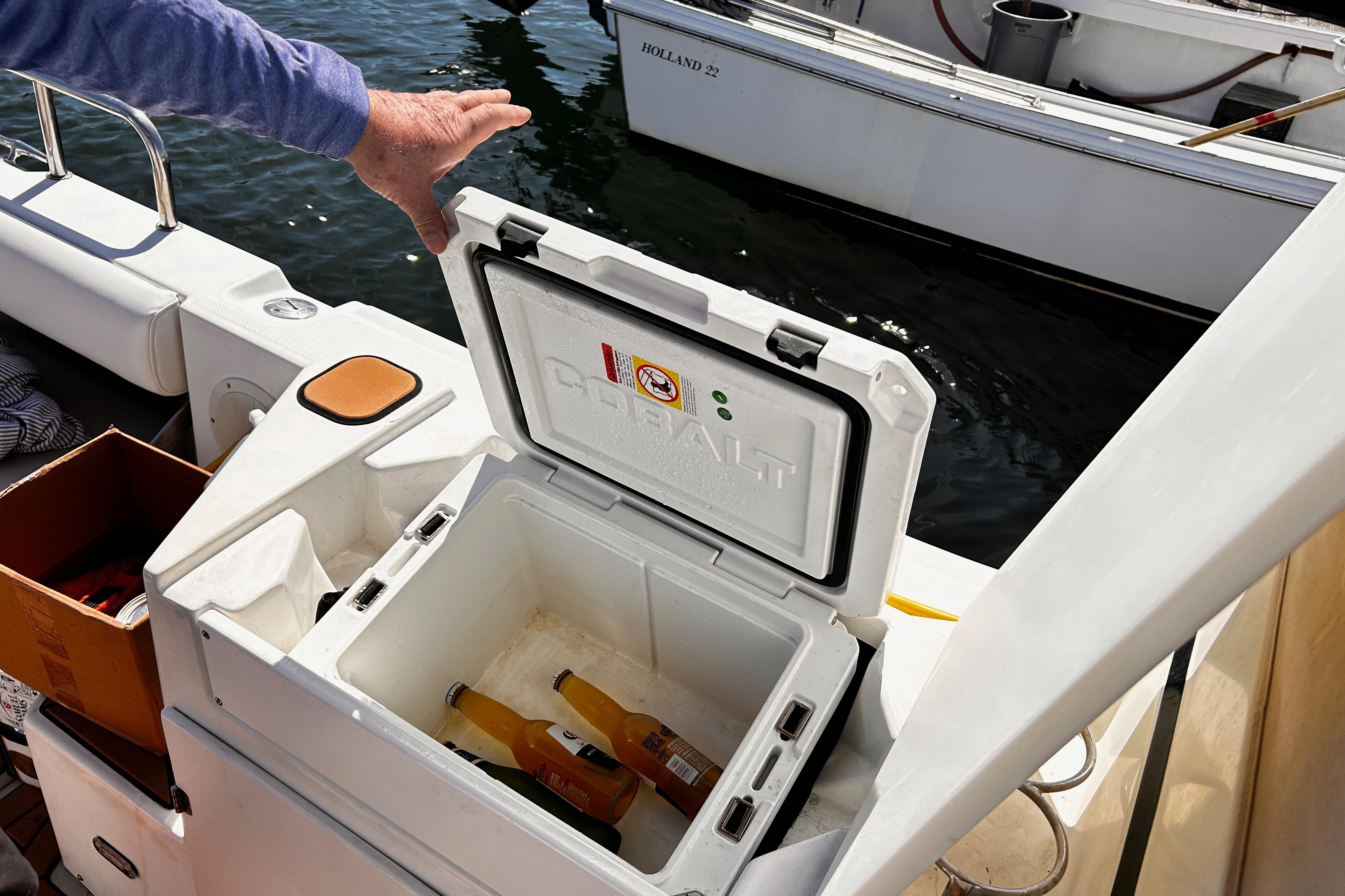 Open cooler with drinks on a 2014 Cutwater C-28 boat deck.