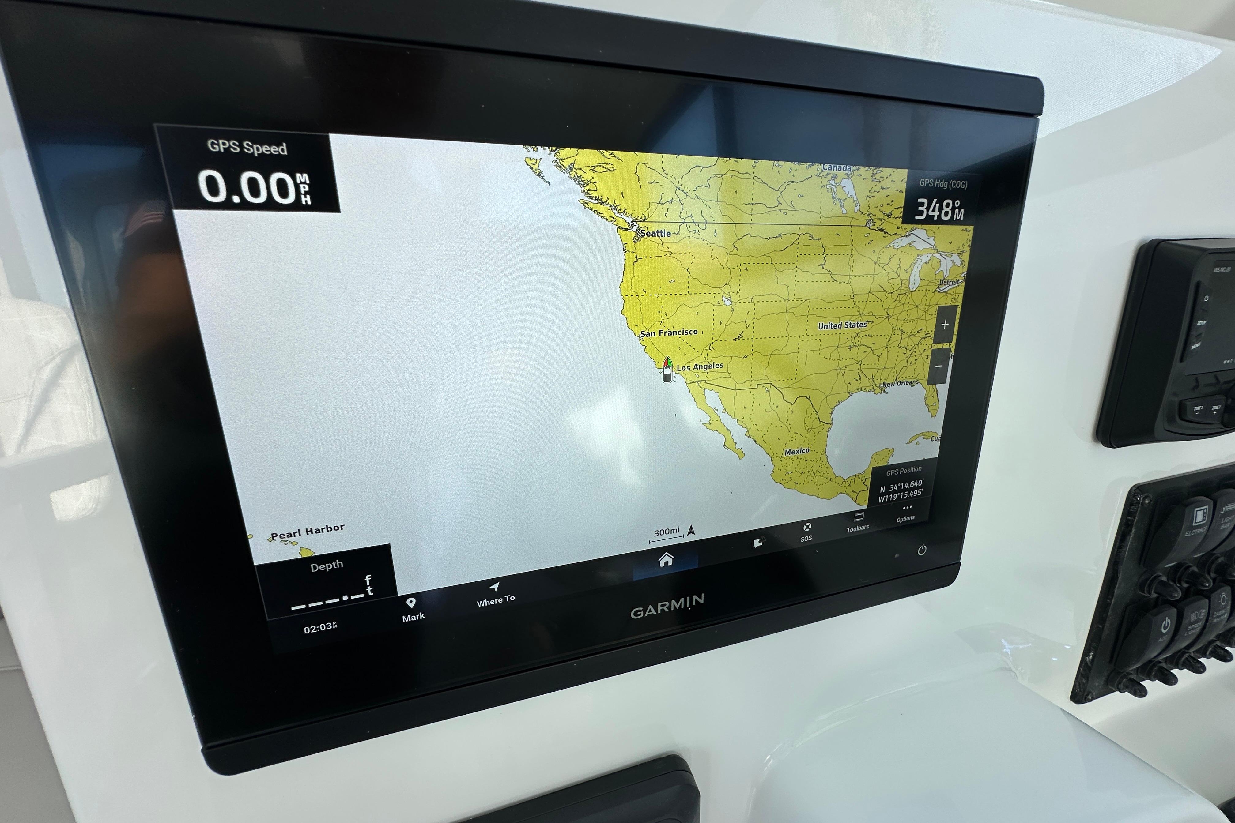 Garmin GPS display on Parker 227 Explorer boat, showing map and speed.