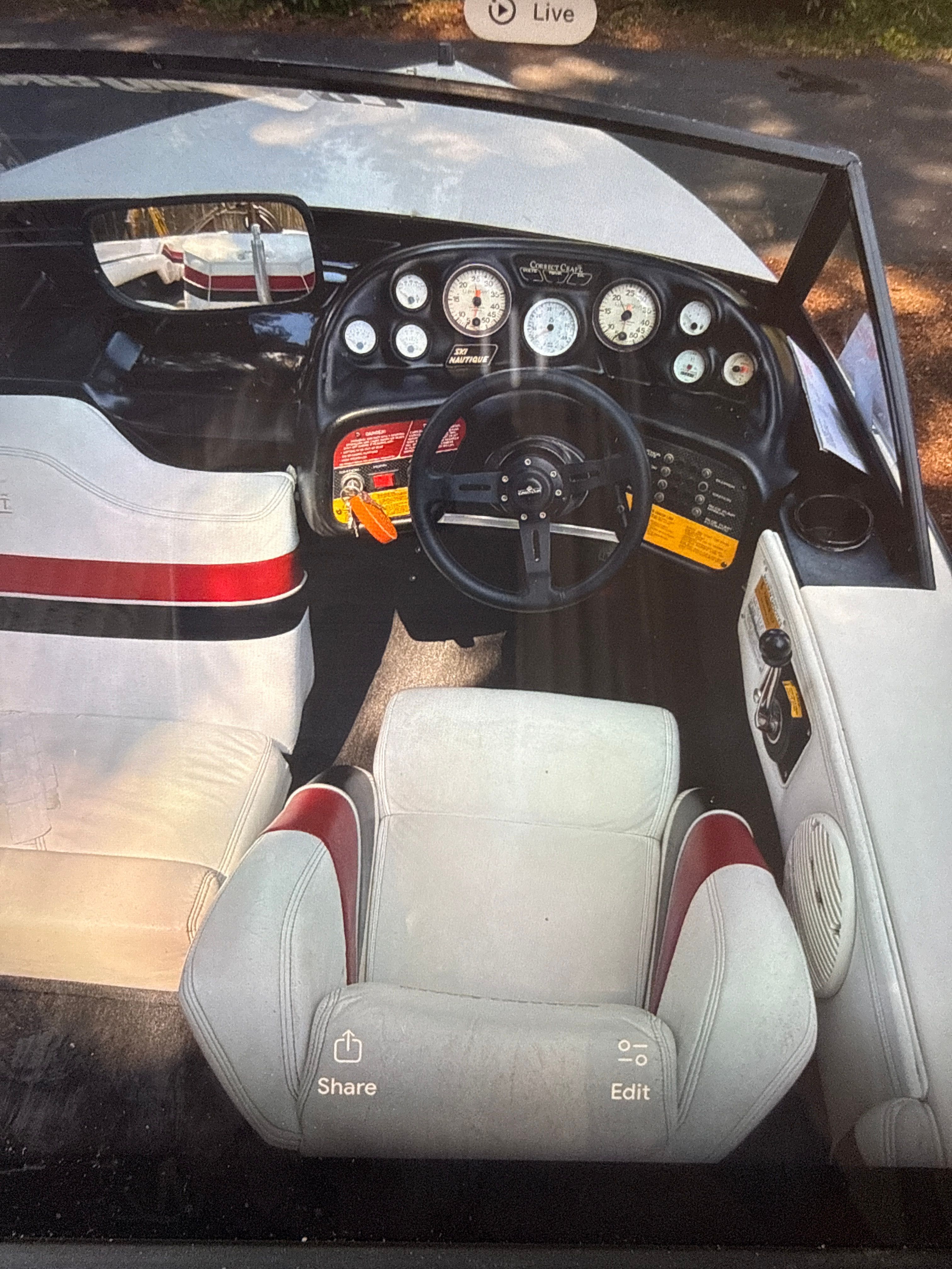 Interior of a 1990 Correct Craft Ski Nautique boat with dashboard.