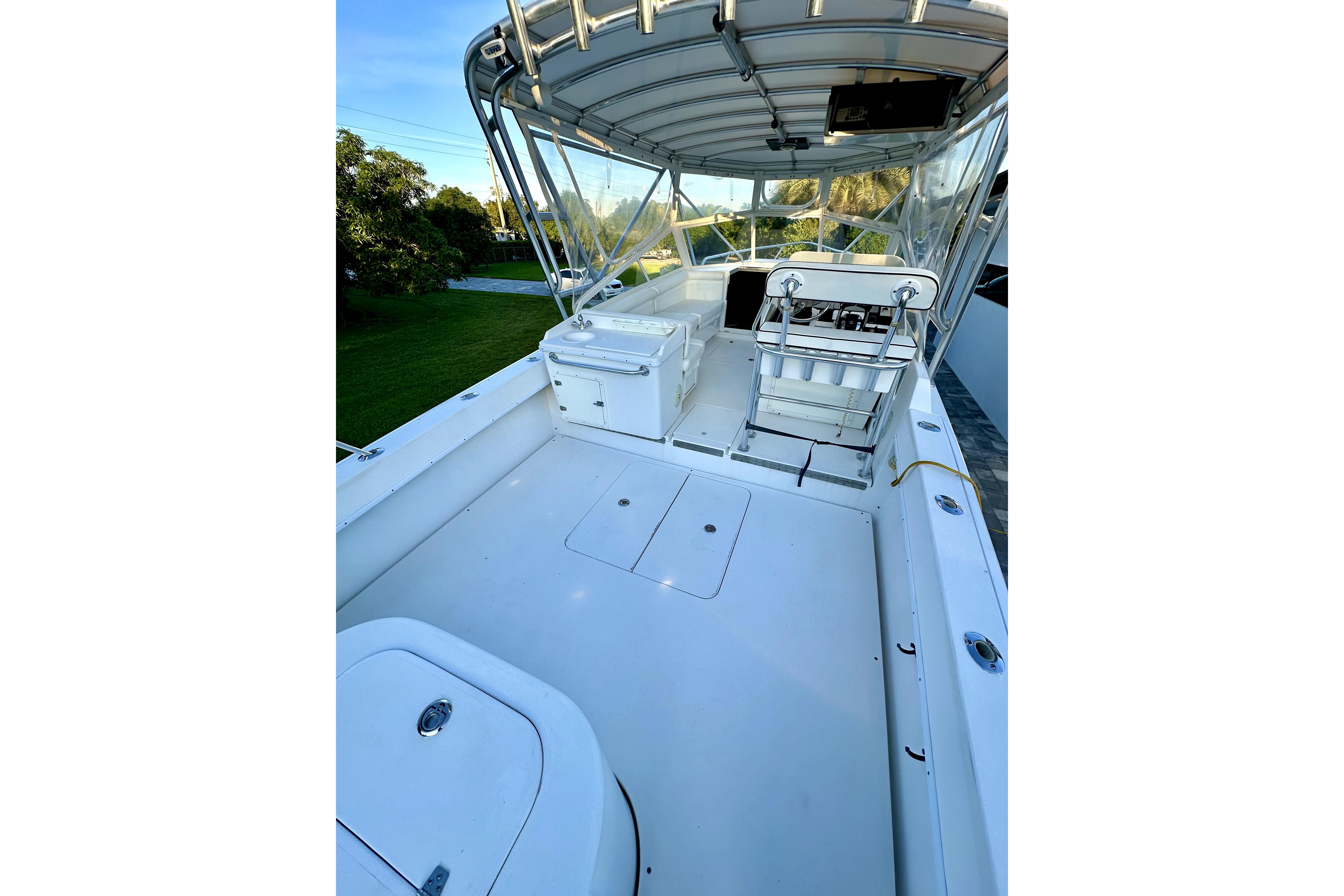 2006 Contender 35 Express Side Console boat with spacious deck and seating area.