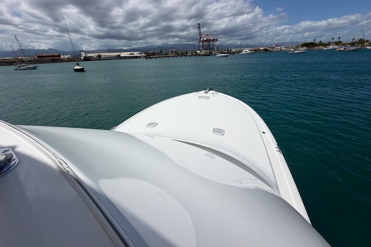 Viking 50 Convertible yacht cruising in a scenic harbor, 2012 model.