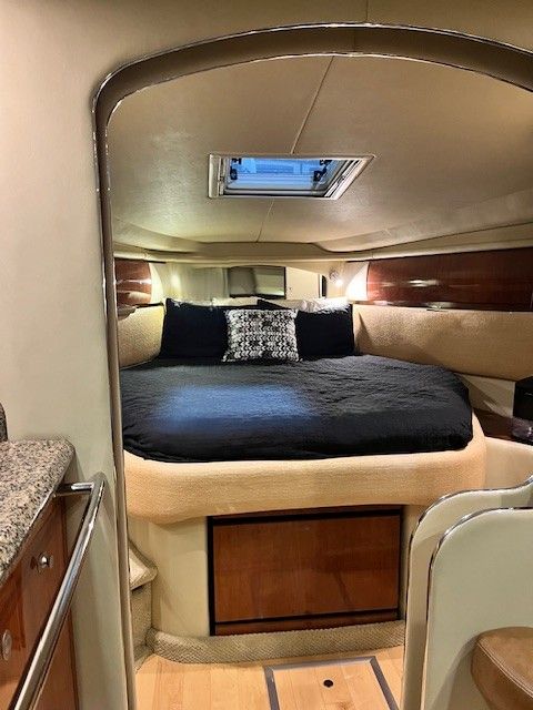 Interior of a 2005 Sea Ray Sundancer yacht with cozy bed.