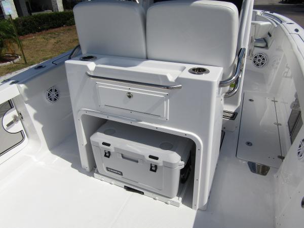 2024 Wellcraft 263 Fisherman boat interior with storage and cooler.