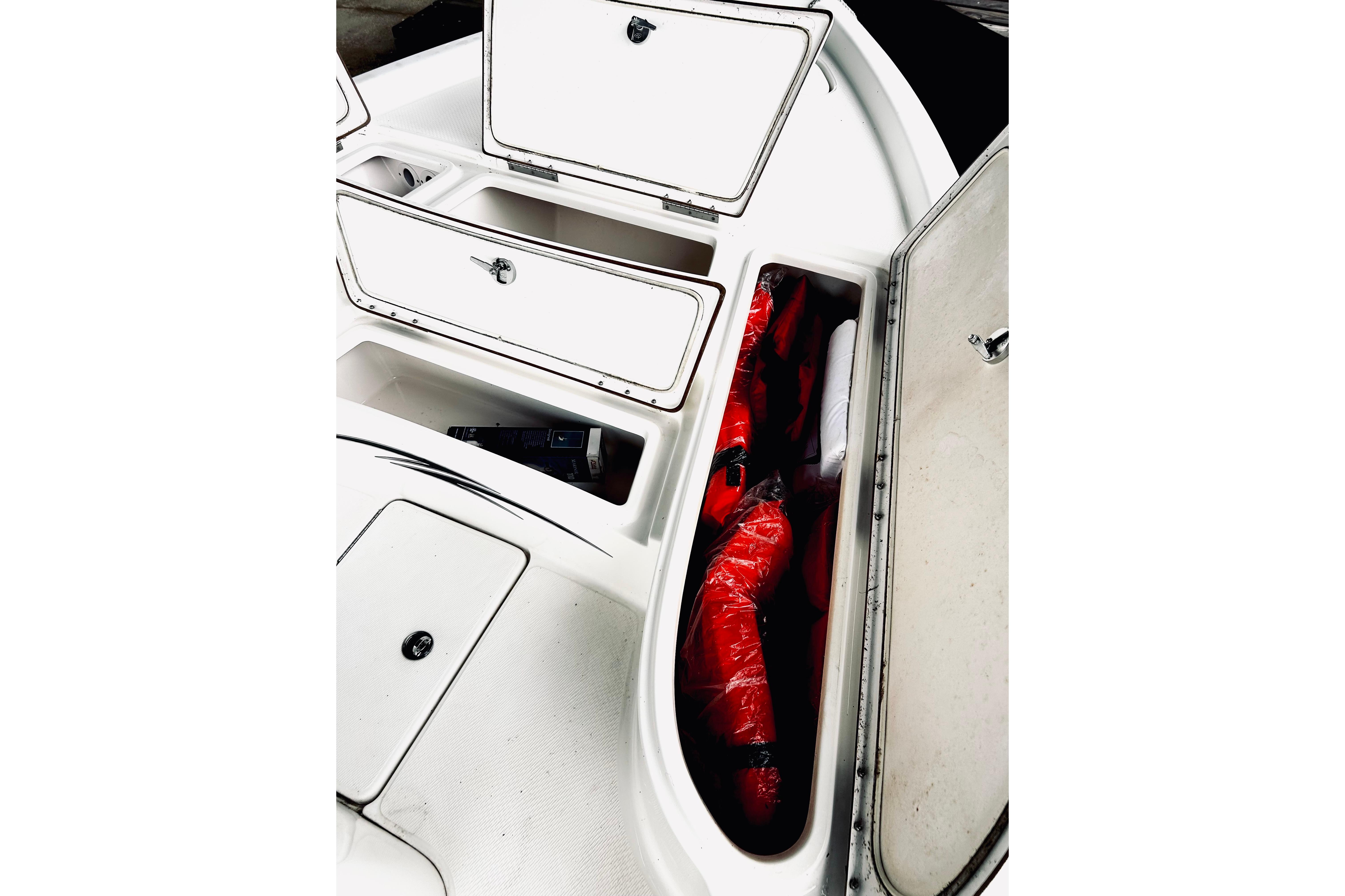 2017 Blue Wave 2200 PureBay boat storage compartments with life jackets.