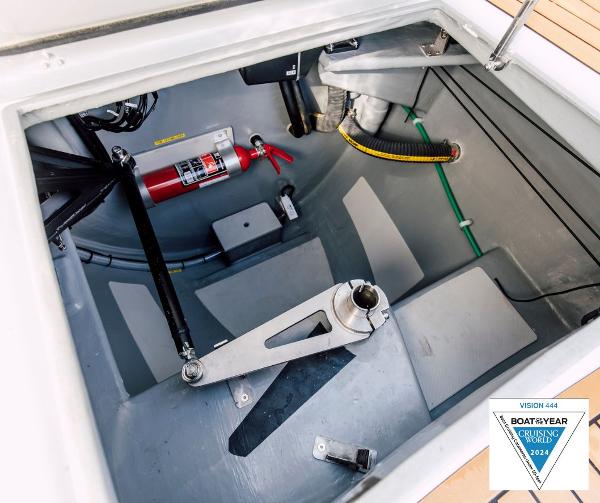 Vision 444 boat interior, 2025 model, featuring a fire extinguisher and mechanical components.