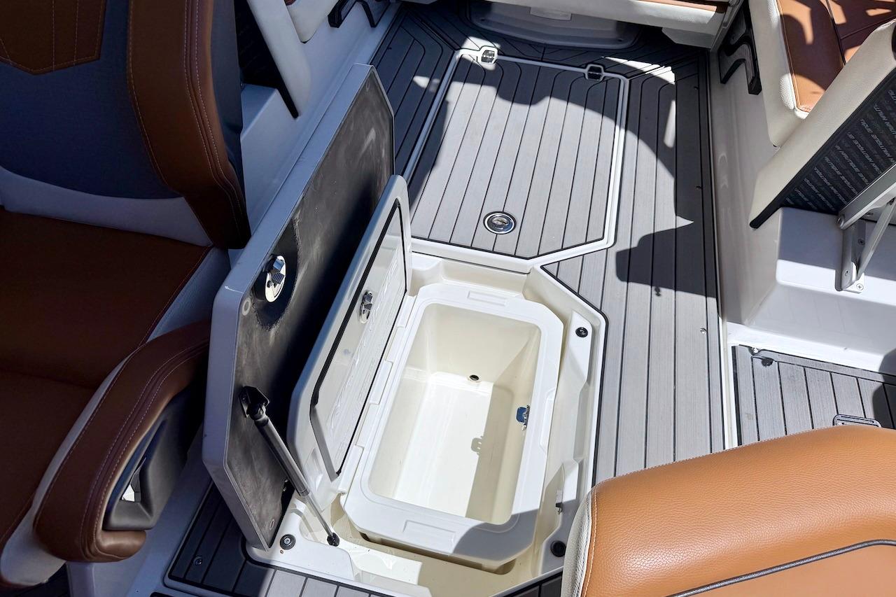 2021 Nautique Super Air Nautique G23 boat interior with open storage compartment.