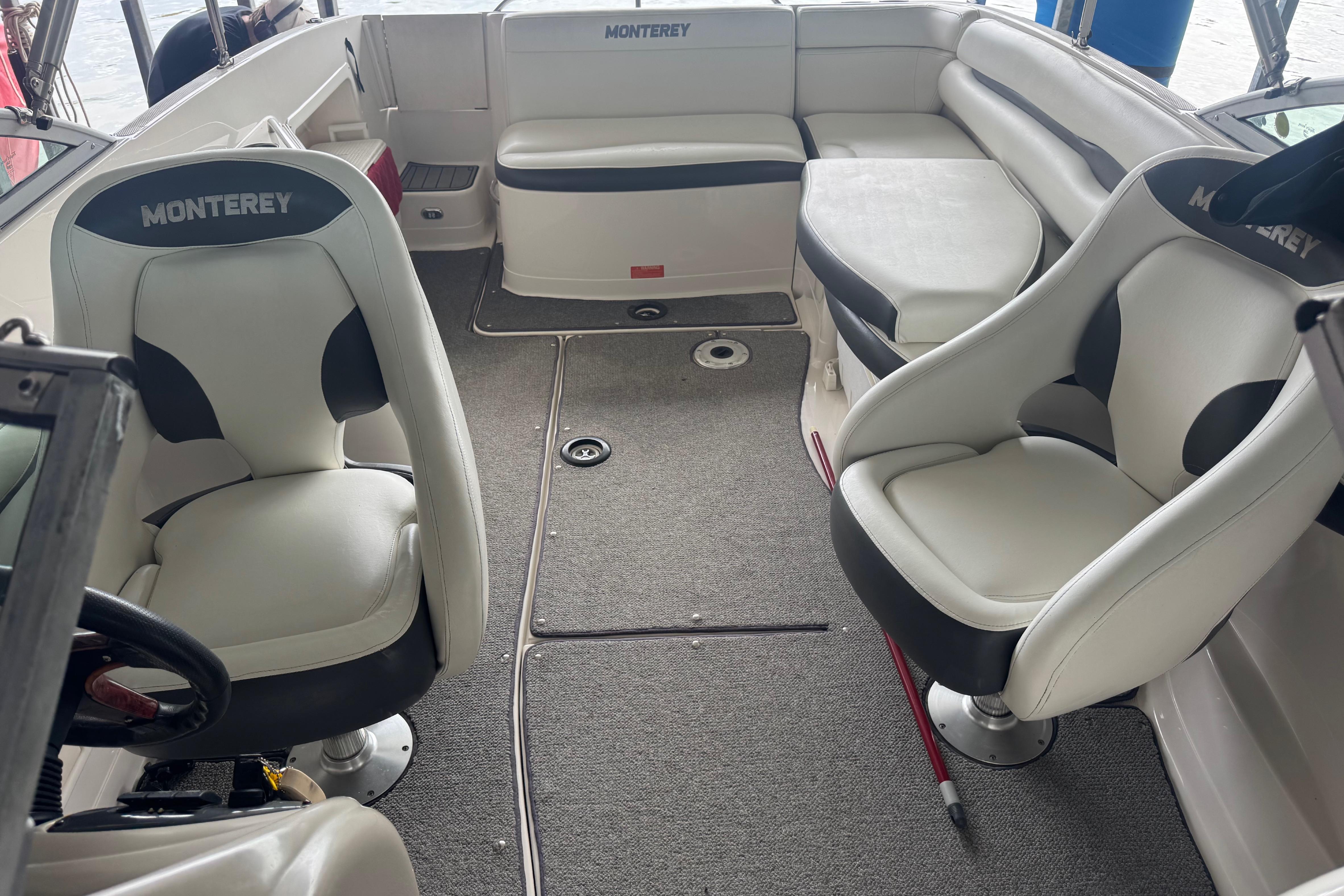 2005 Monterey 248LS Montura Bowrider interior with seating and steering wheel.