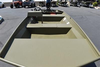 2025 Lowe L1652MT Jon boat, olive green, parked outdoors on pavement.