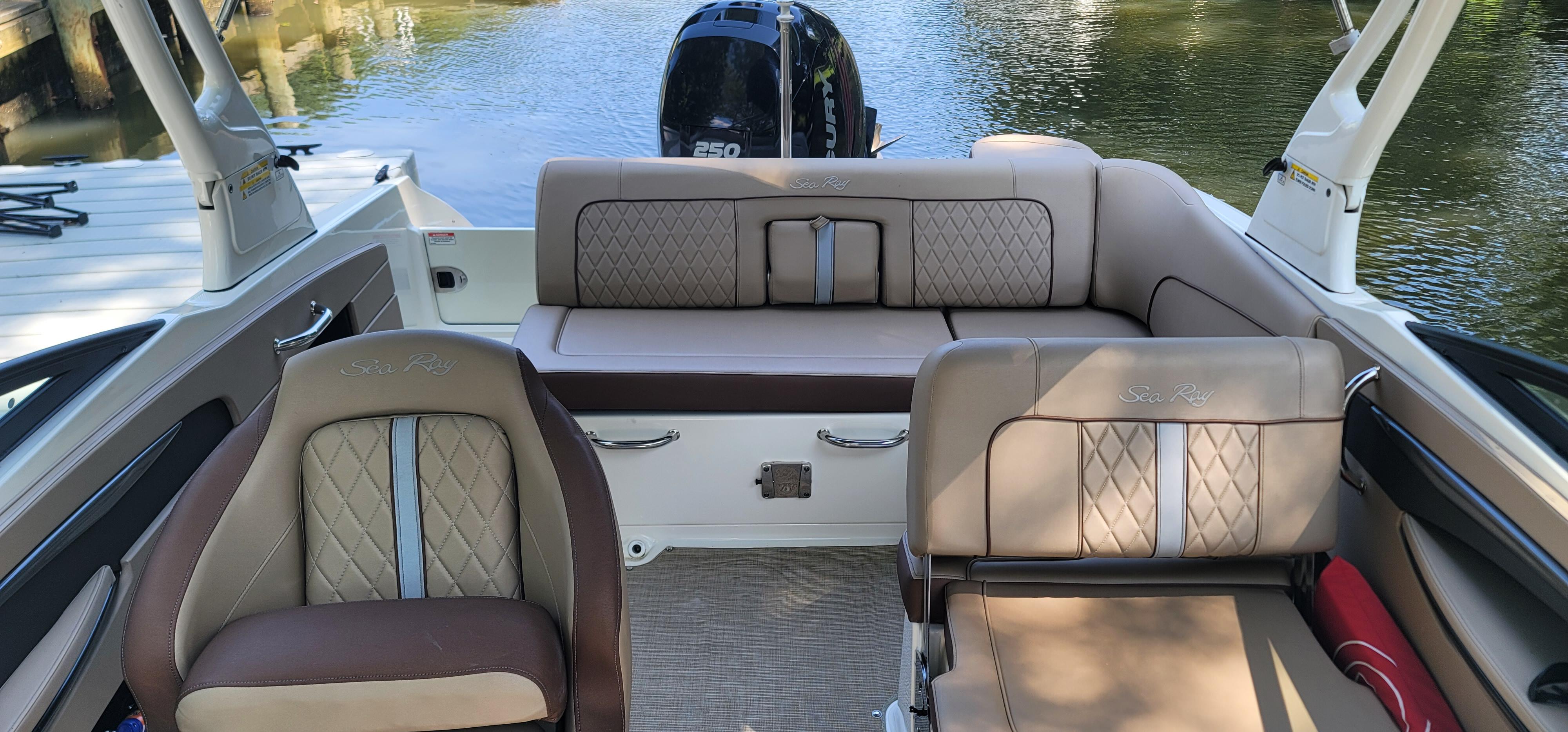 2017 Sea Ray SDX 240 Outboard interior with luxurious seating and water view.