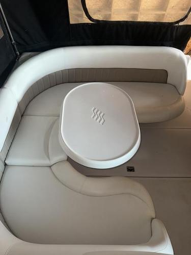 2005 Four Winns 298 Vista boat interior with white seating and table.