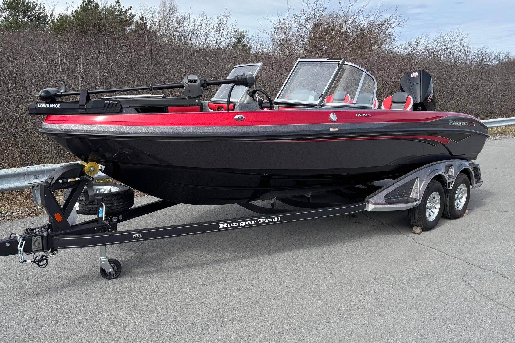 2025 Ranger 2050MS boat on trailer, featuring sleek black and red design.