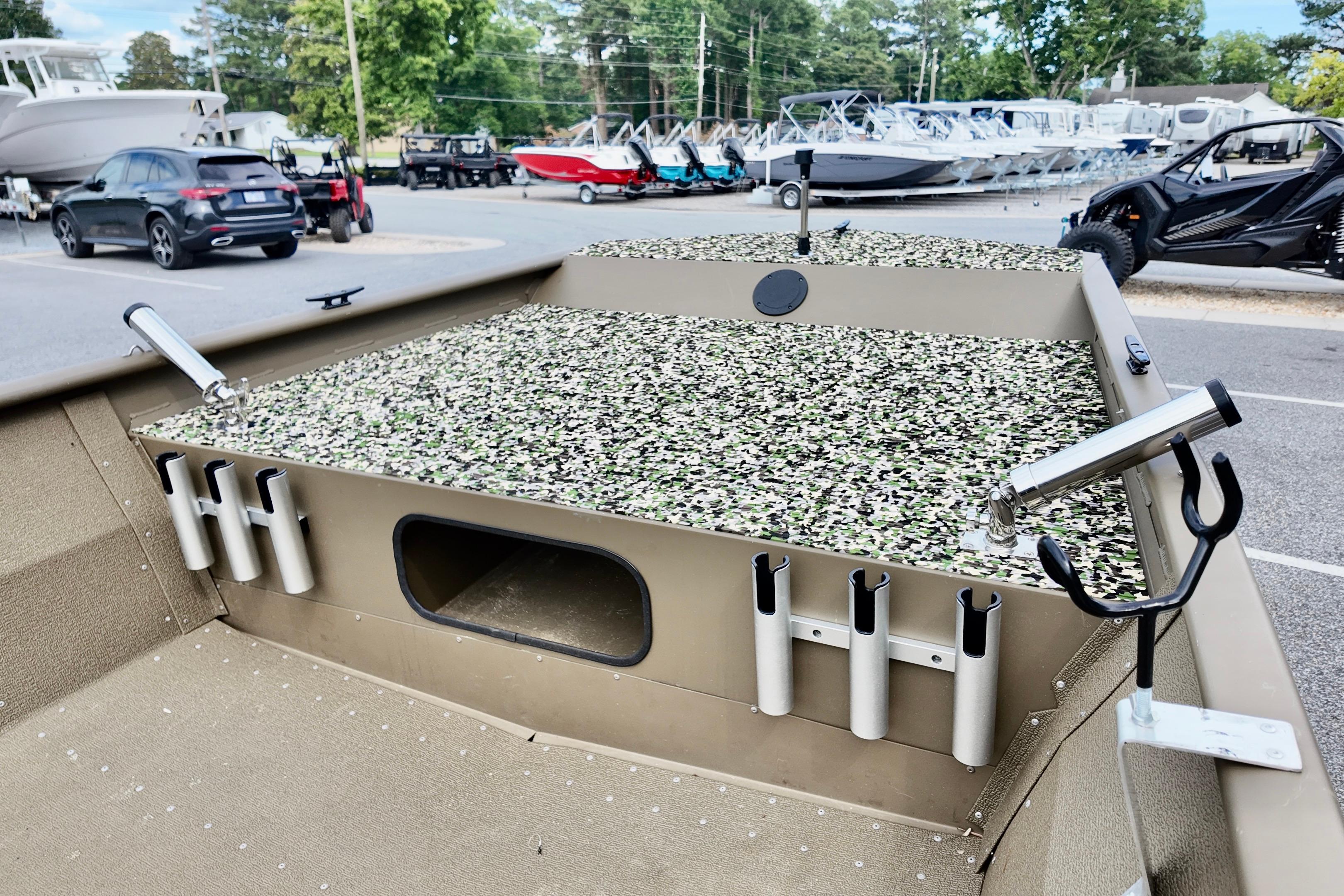2025 G3 BOATS 1860 SC with camo deck, rod holders, and storage compartment.