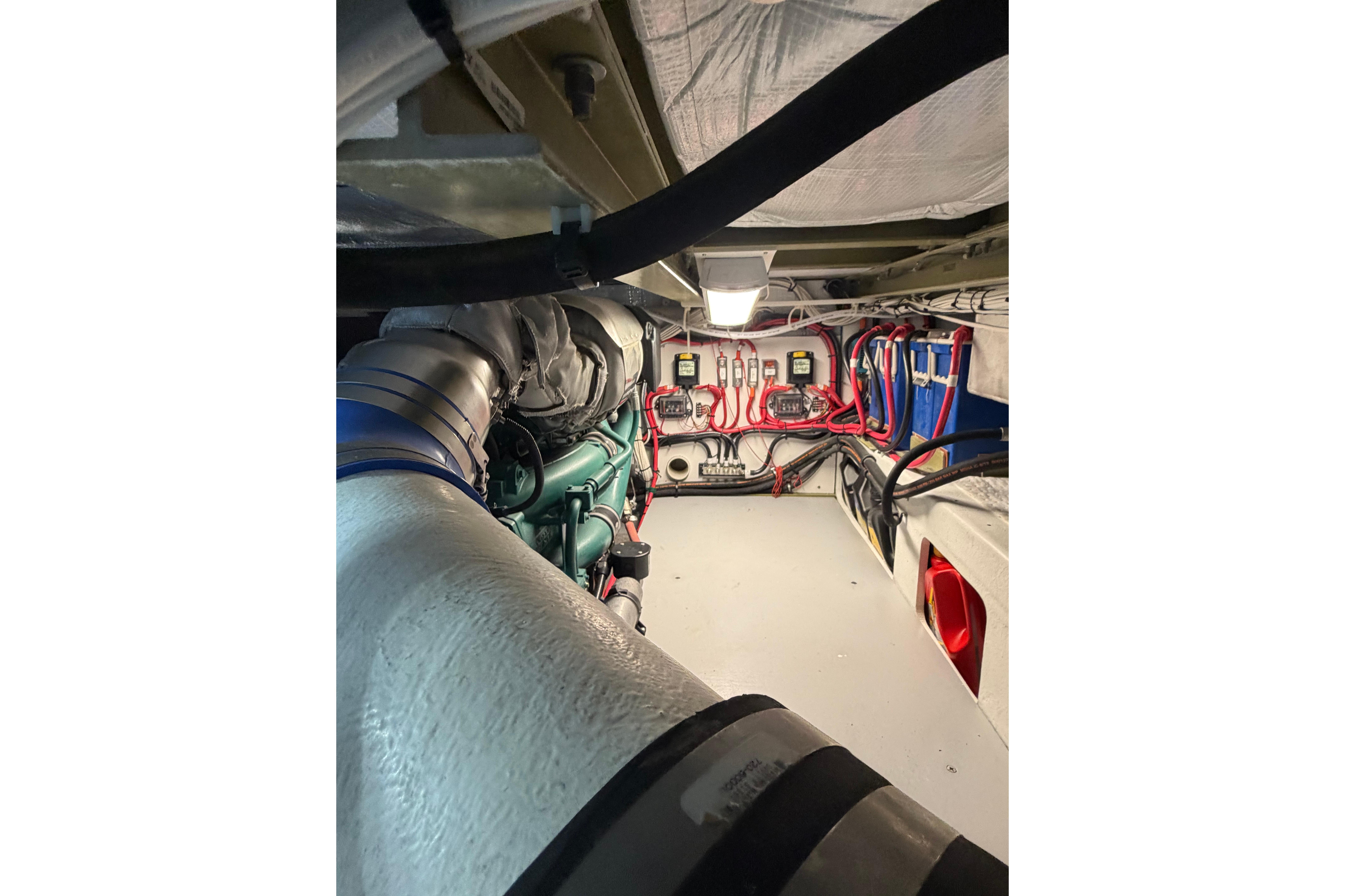 Engine room of a 2018 H&H Marine Osmond Beal boat, showcasing wiring and components.