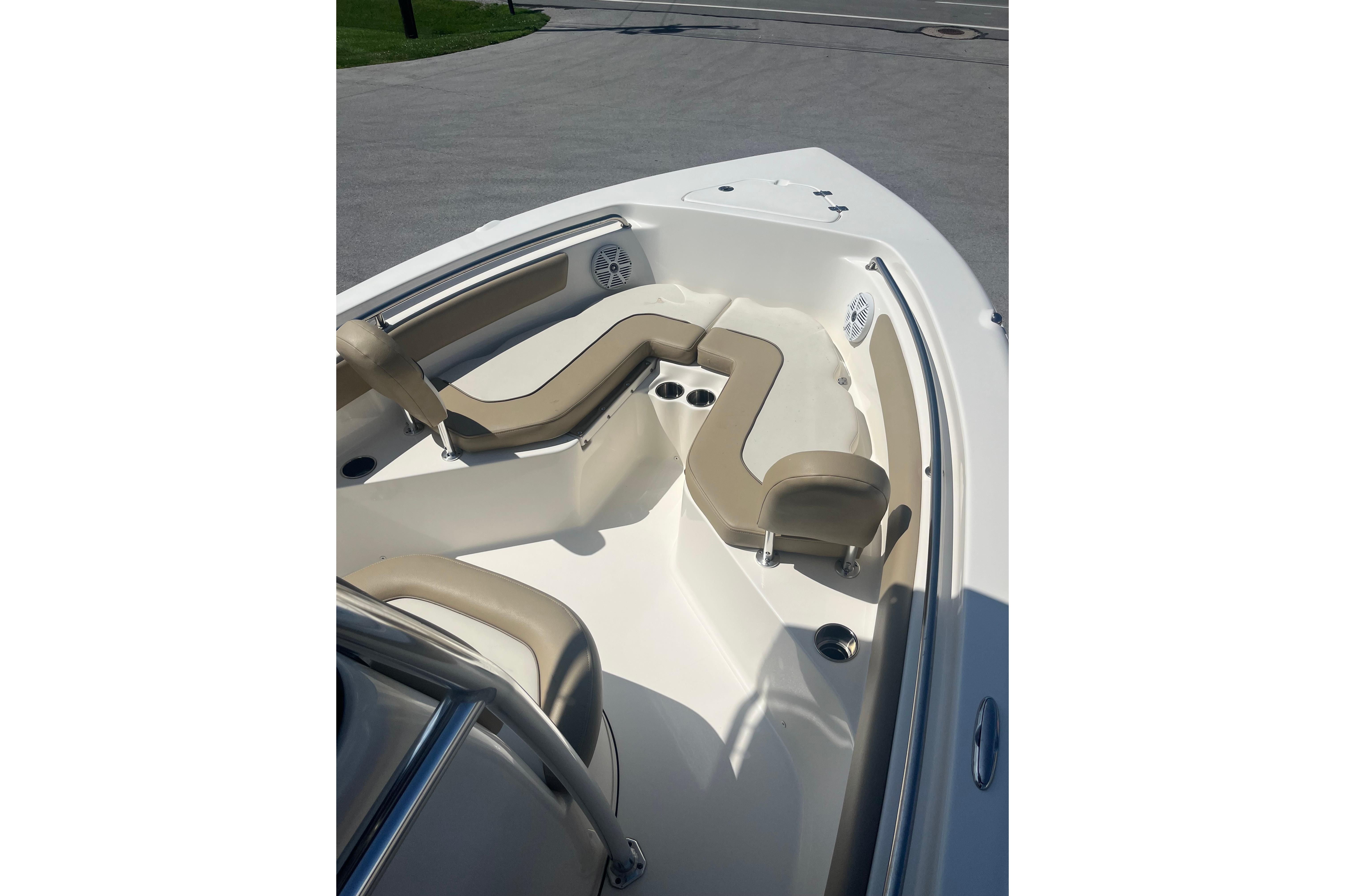 2017 Key West 203 FS boat interior with beige seating and cup holders.
