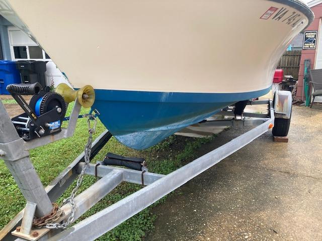 1995 KenCraft Challenger 190 boat on trailer, blue hull, parked outdoors.