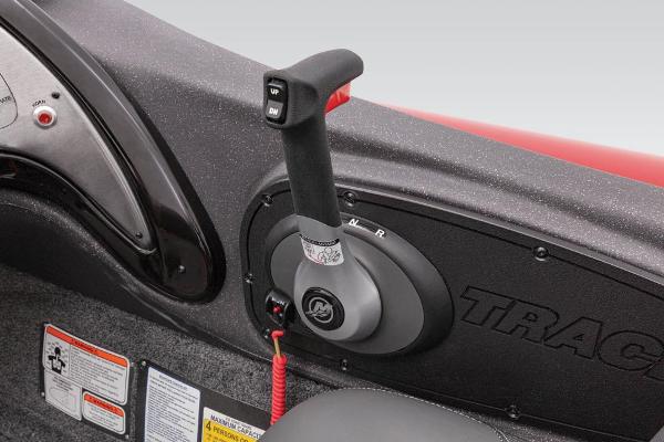 Close-up of a throttle lever in a boat, surrounded by gray and red interior.